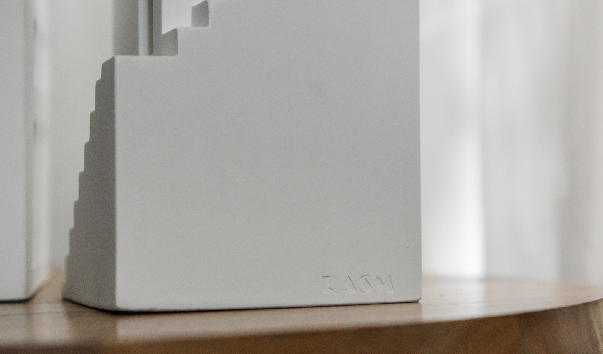 rasm minaret sculpture engraved with RASM logo